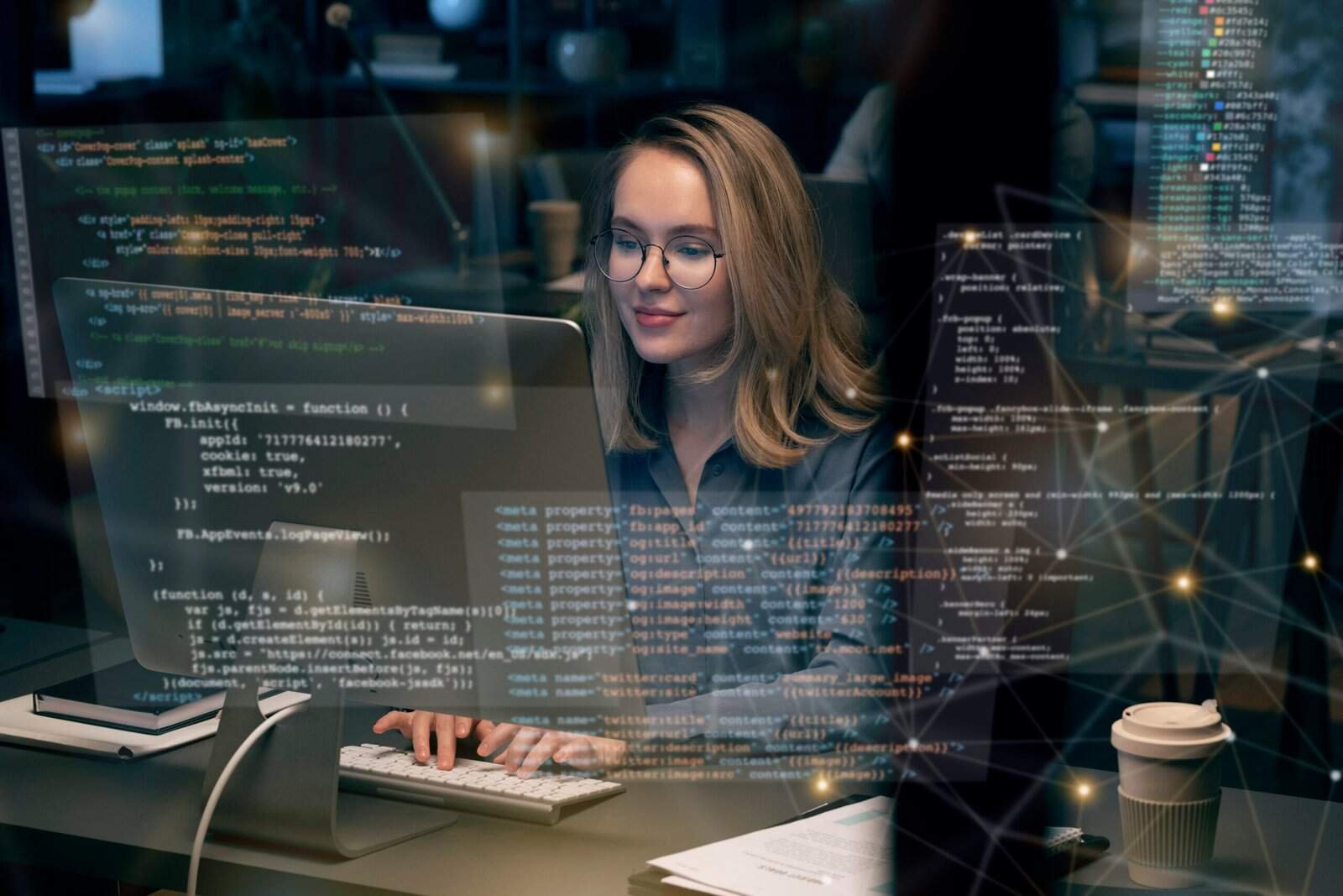 Woman coding at a computer with digital code overlays, representing tech courses.